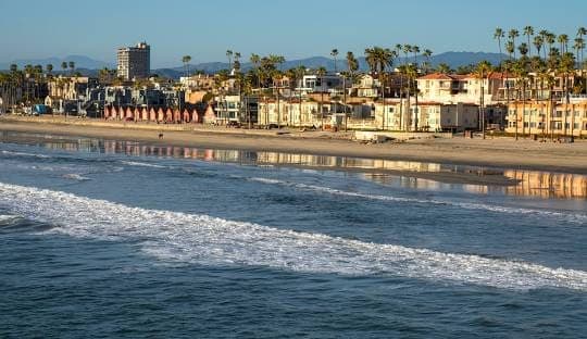 Oceanside, California beachfront homes and shoreline seen from the Oceanside Pier